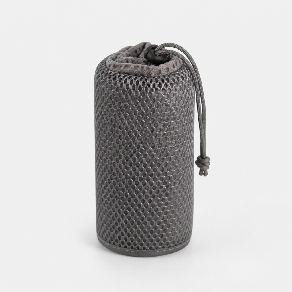 Travel towel packed in a mesh pouch